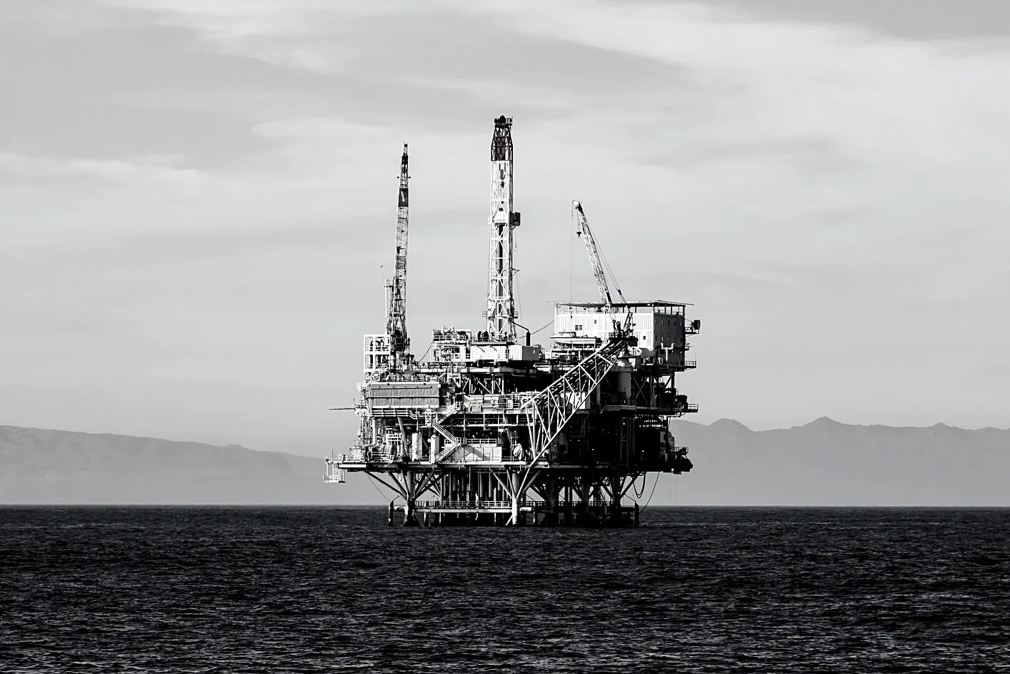 An offshore oil platform on a calm sea